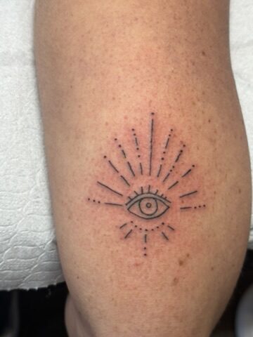 Fine line protective eye tattoo